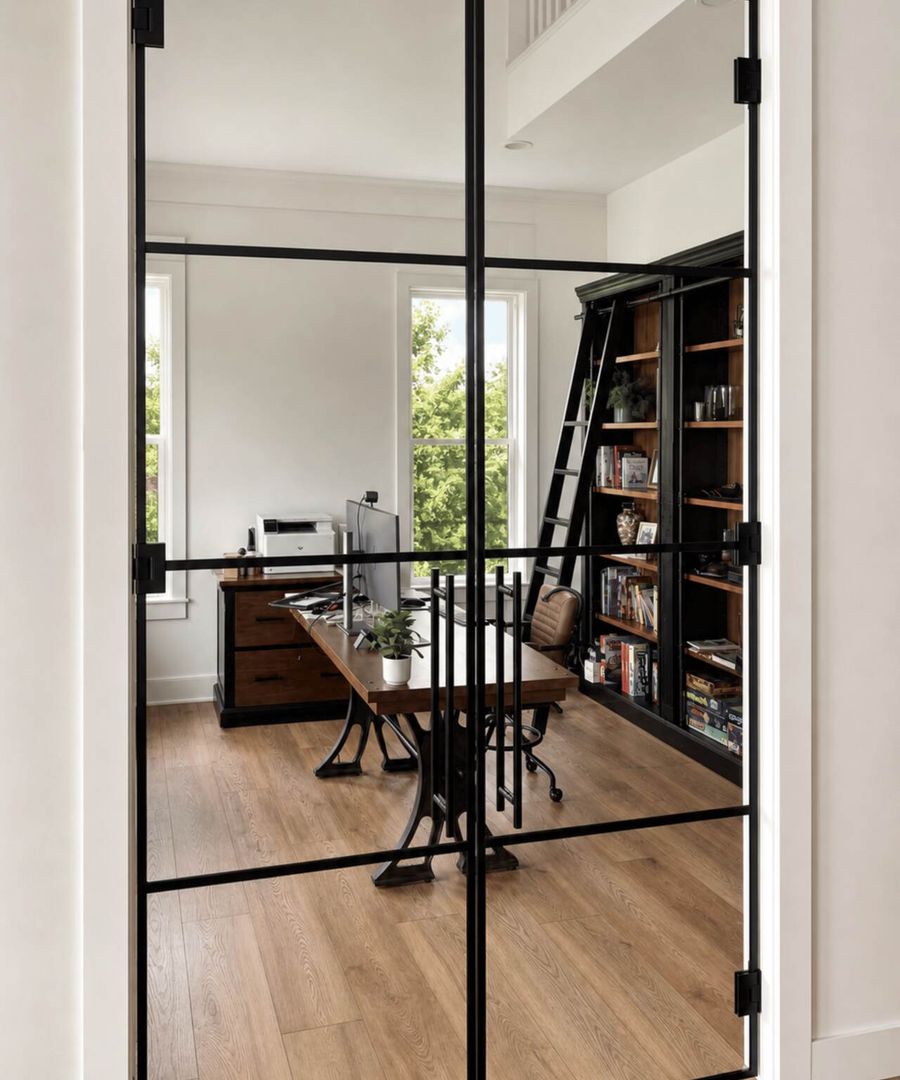 Glass partition between a home office and a hallway