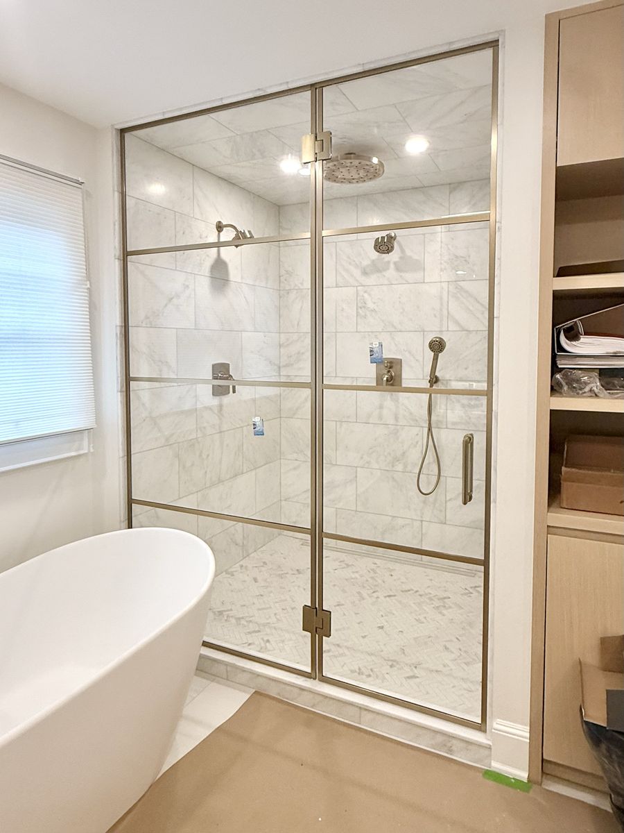 Grid shower door in bronze