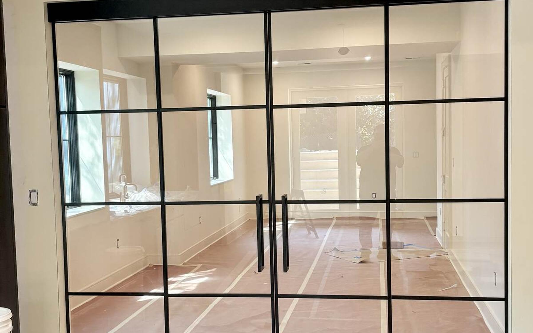 Glass partition doors installed in a house still under construction