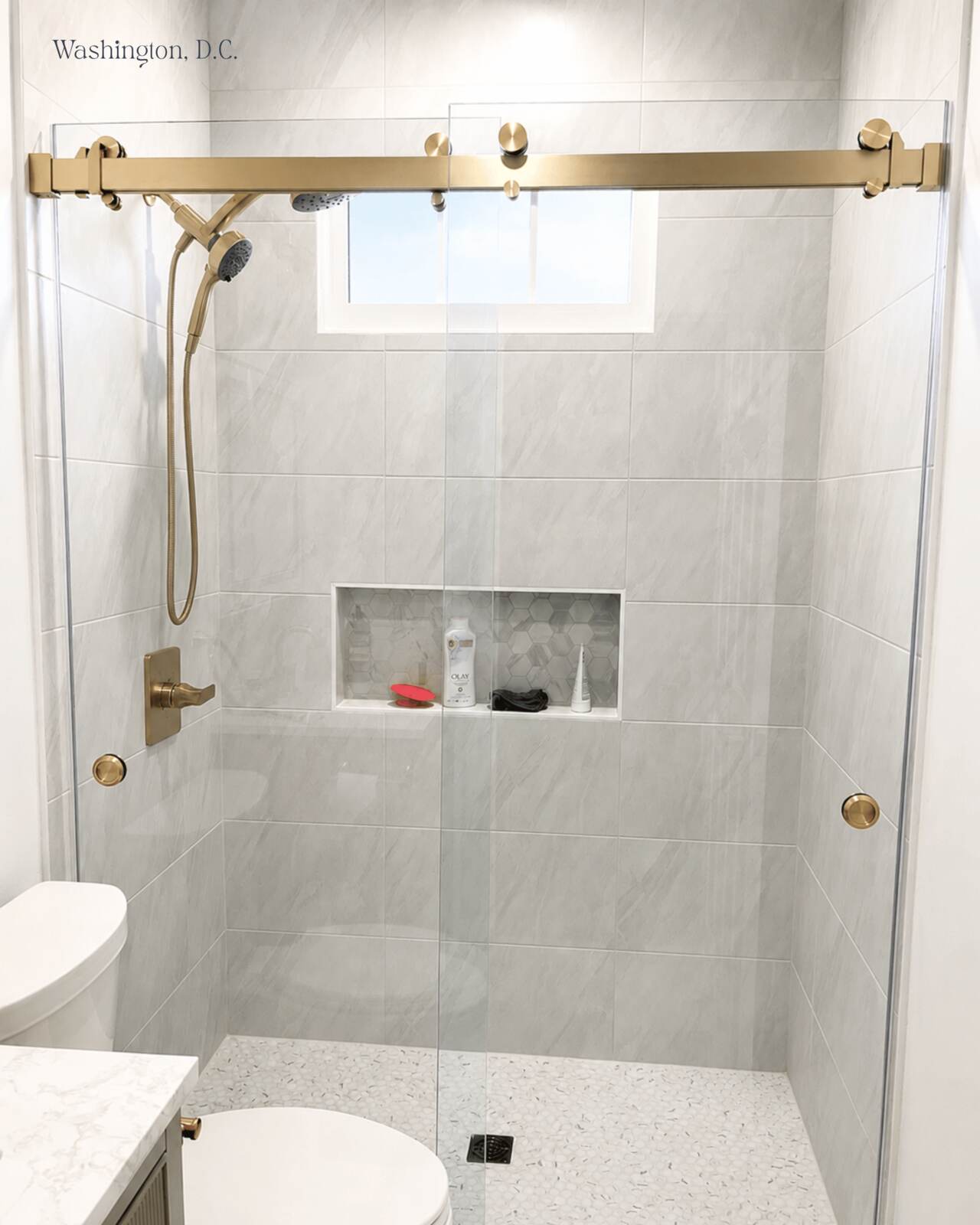 Frameless glass shower enclosure
