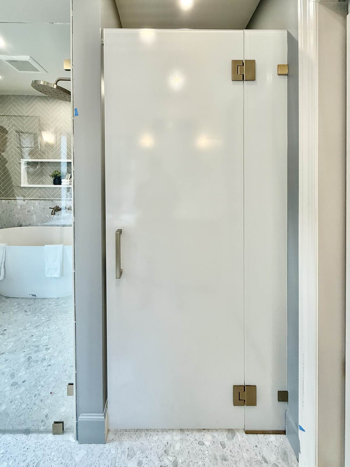 Frameless sliding shower door