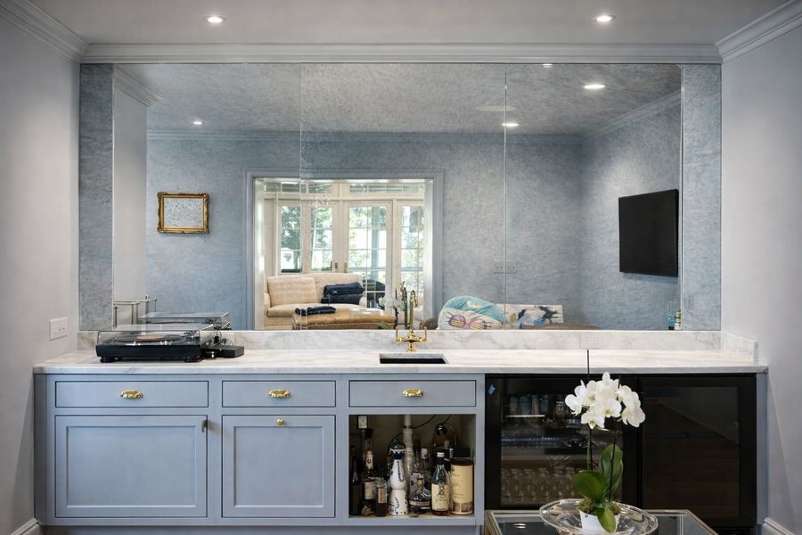Antique mirror backsplash behind a home bar