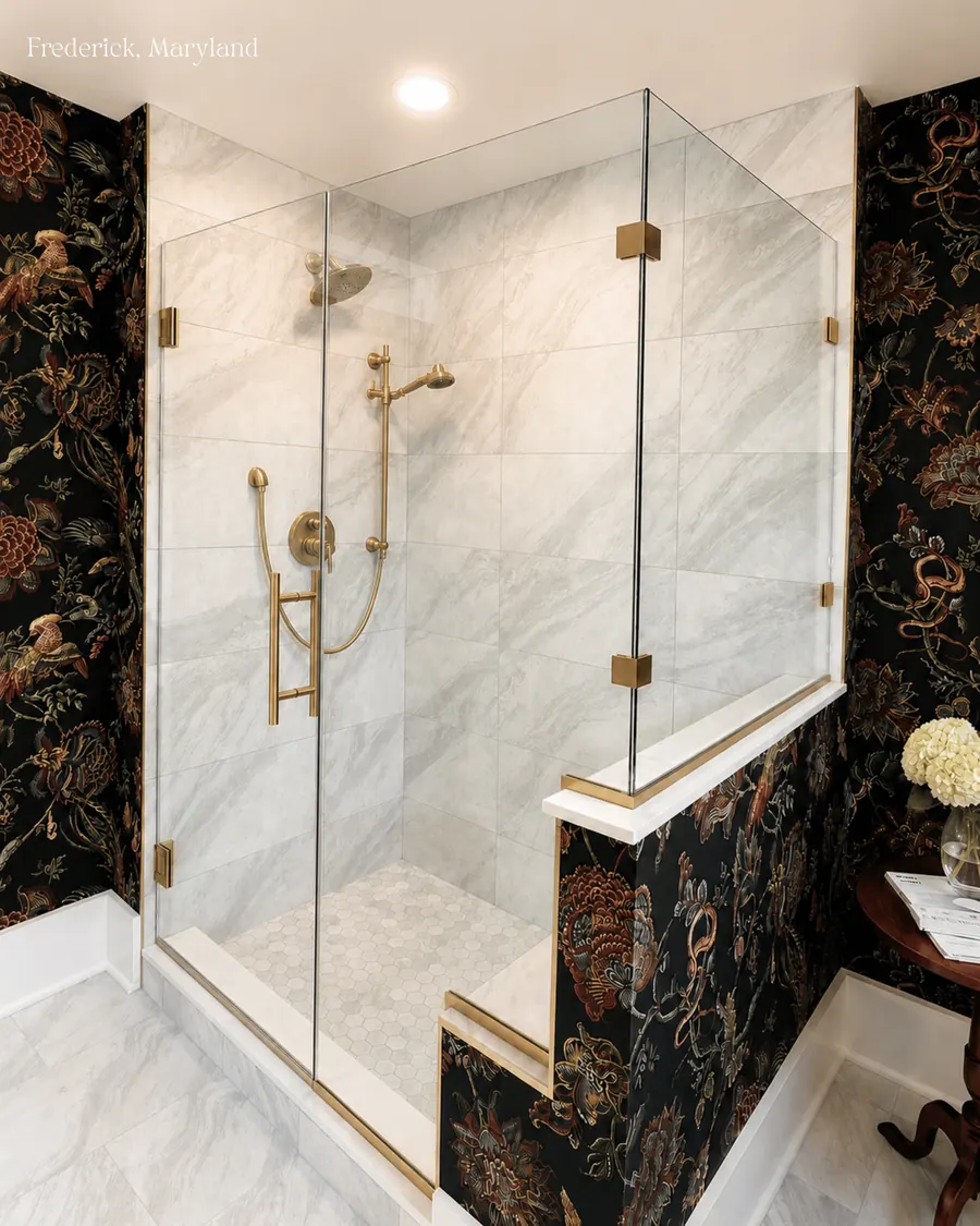 90 degree corner frameless glass shower enclosure, satin brass hardware, notched panels