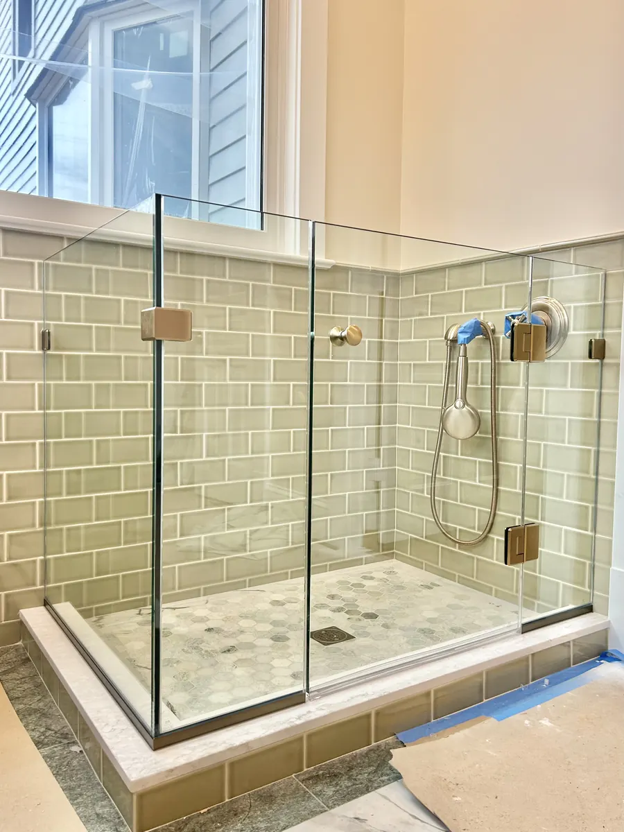 90 degree corner frameless glass shower enclosure, brushed bronze hardware, Doggy Door in Washington DC