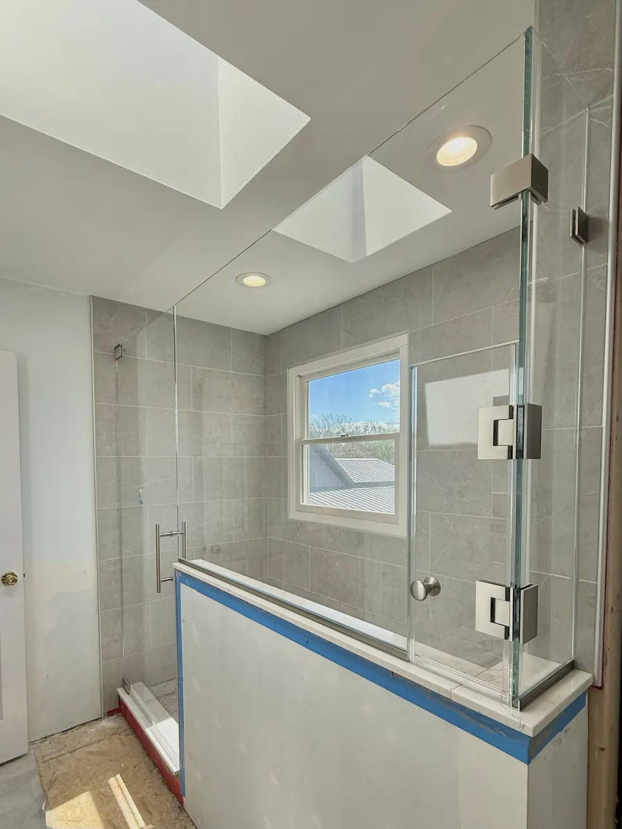 90 degree corner frameless glass shower enclosure, brushed nickel hardware, custom access door