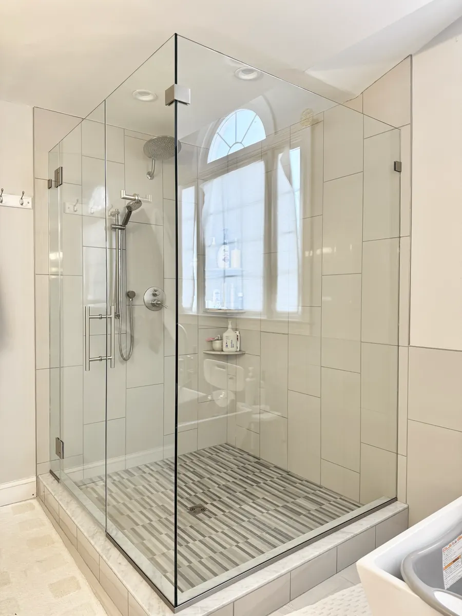 90 degree corner frameless glass shower enclosure, brushed nickel hardware, ladder