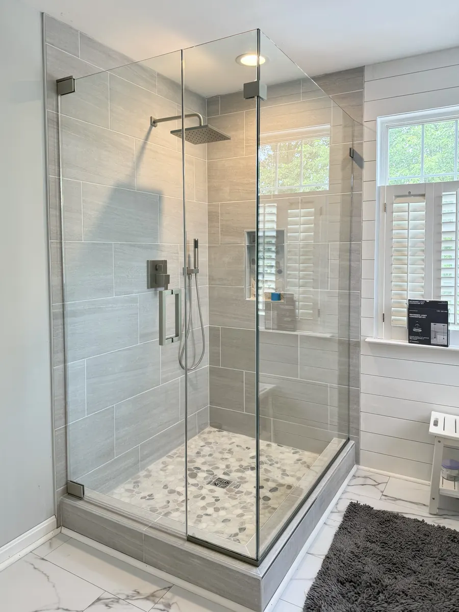 90 degree corner frameless glass shower enclosure, brushed nickel hardware, square pull