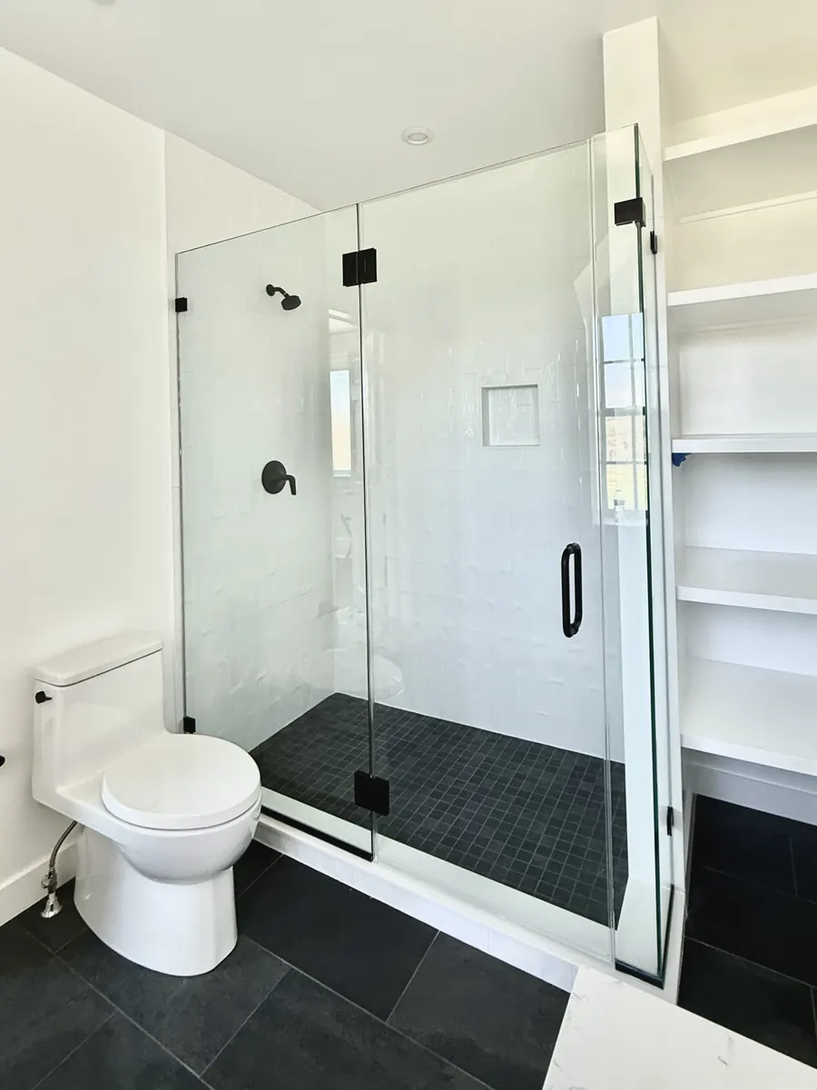 90 degree corner frameless glass shower enclosure, matte black hardware