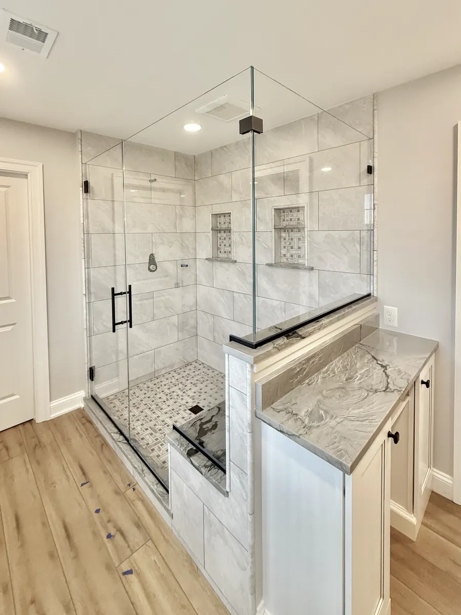 90 degree corner frameless glass shower enclosure, matte black hardware, double notch