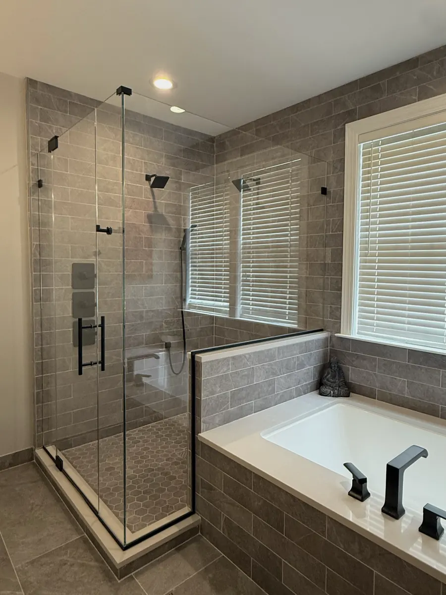 90 degree corner frameless glass shower enclosure, matte black hardware, ladder and robe hook