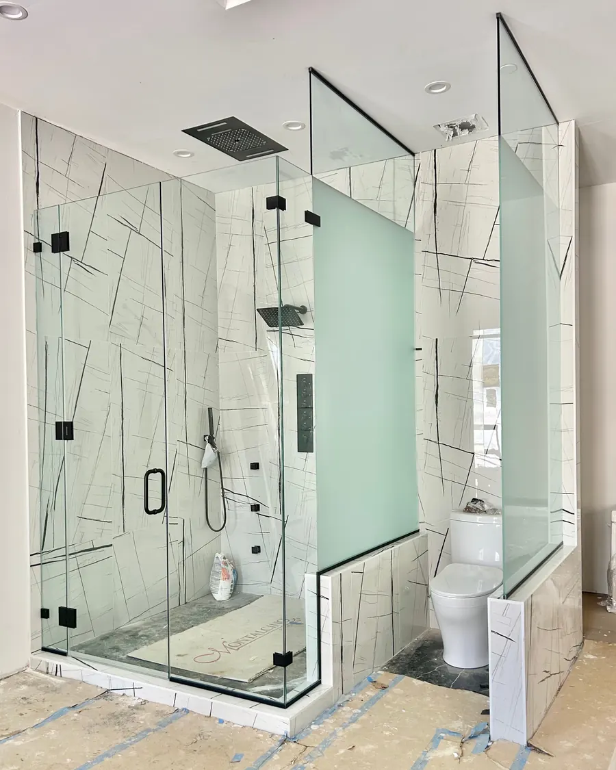 90 degree corner frameless glass shower enclosure, matte black hardware, privacy etched glass