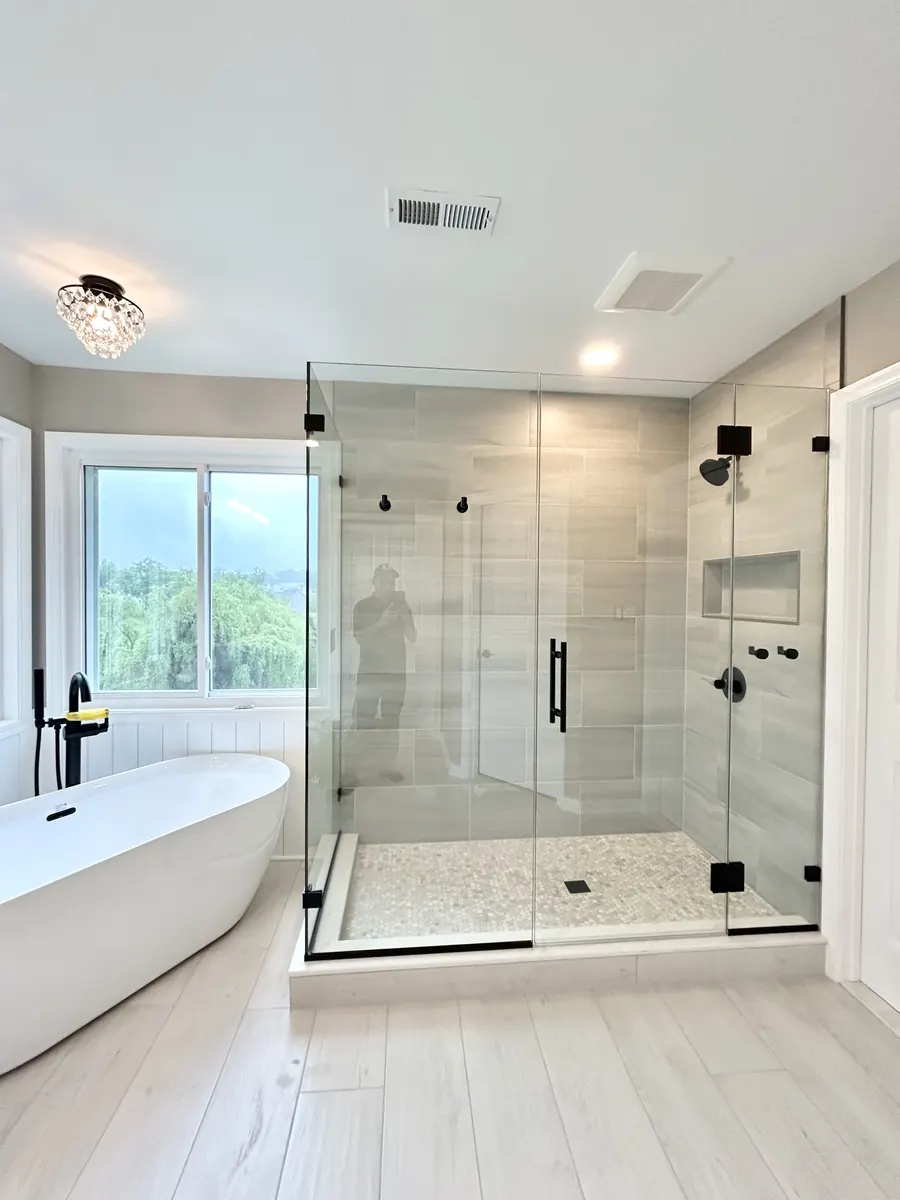 90 degree corner frameless glass shower enclosure, matte black hardware, Shower Door in Cockeysville, Maryland