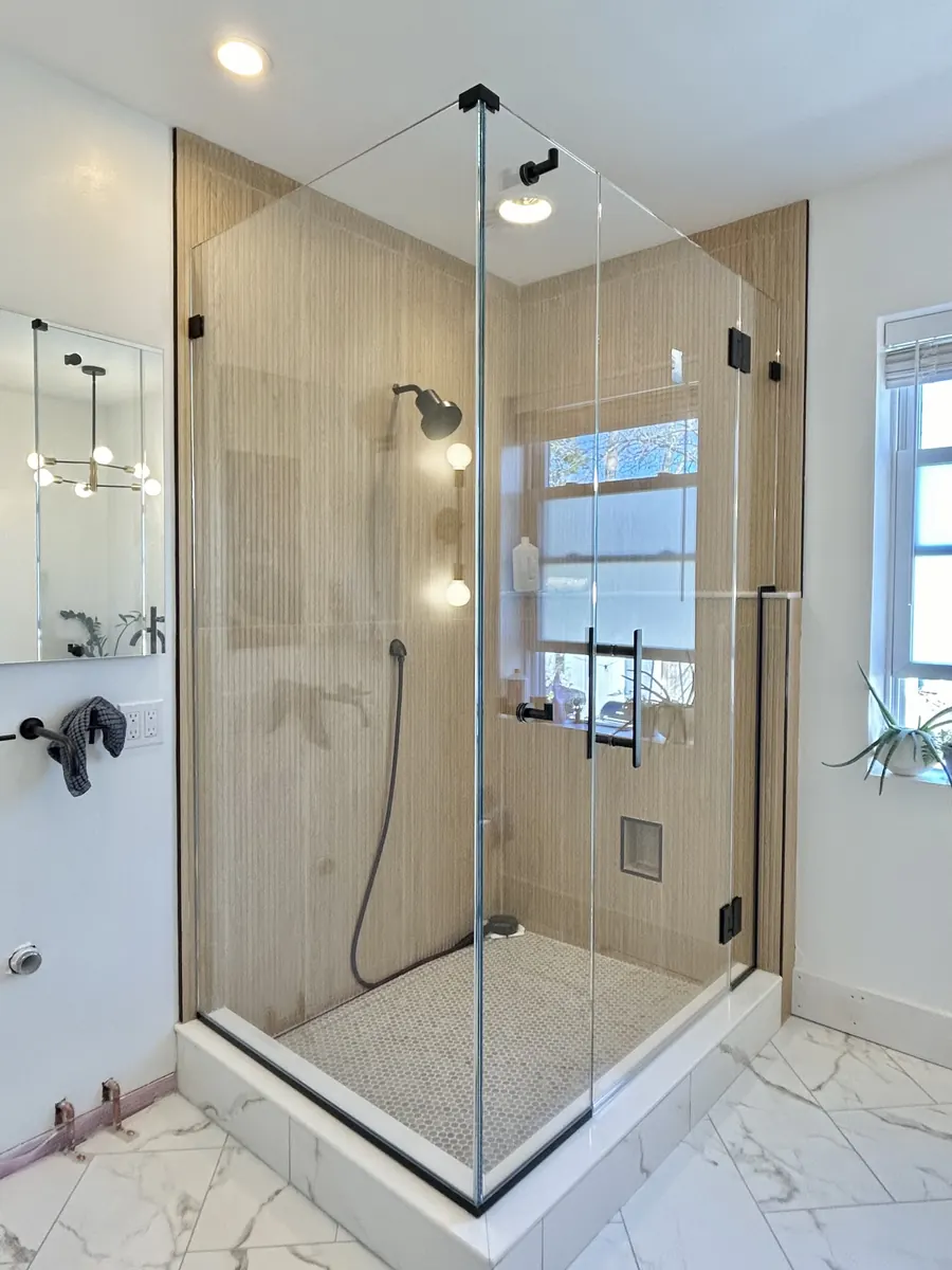 90 degree corner frameless glass shower enclosure, matte black hardware, Shower Door in Four Corners, Sunset Terrace