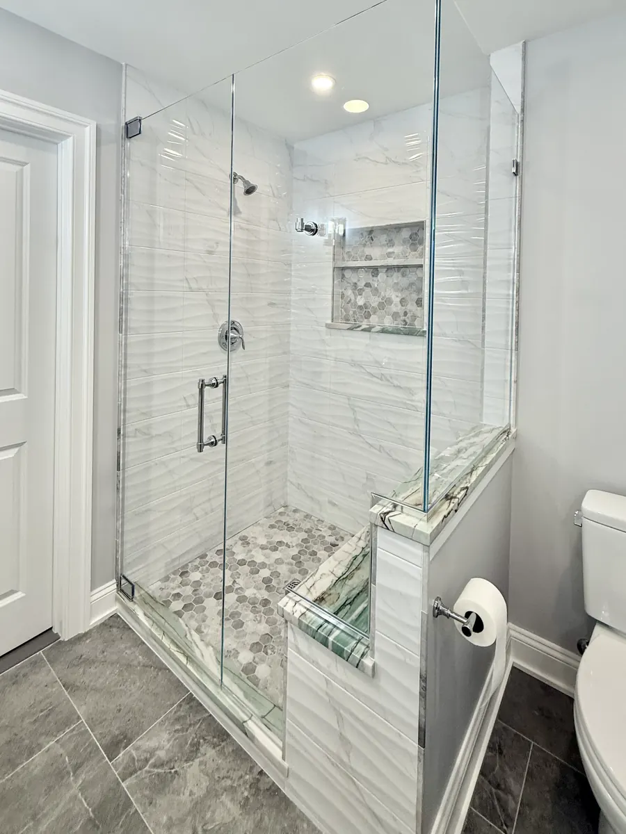 90 degree corner frameless glass shower enclosure, polished chrome hardware, double notch
