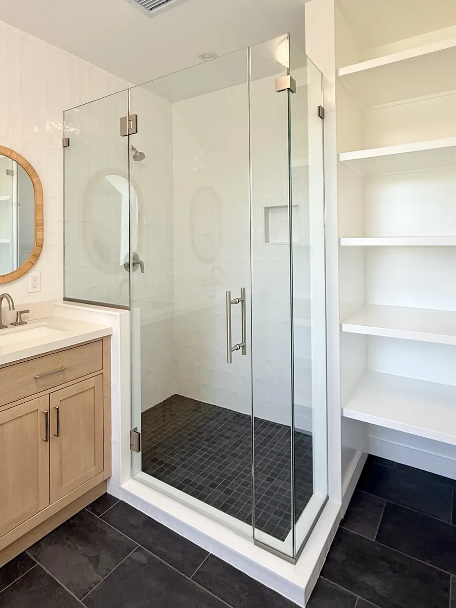 90 degree corner frameless glass shower enclosure, polished nickel hardware, ladder