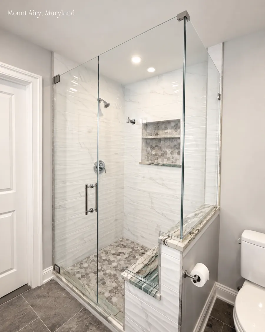 90 degree corner frameless glass shower enclosure, polished nickel hardware, with a notch