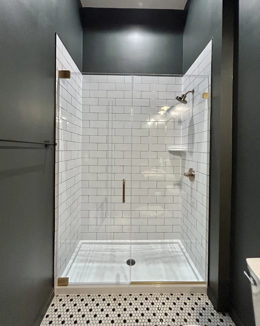 Door and panel frameless glass shower enclosure, satin brass hardware, Frameless Shower Door in Linganore