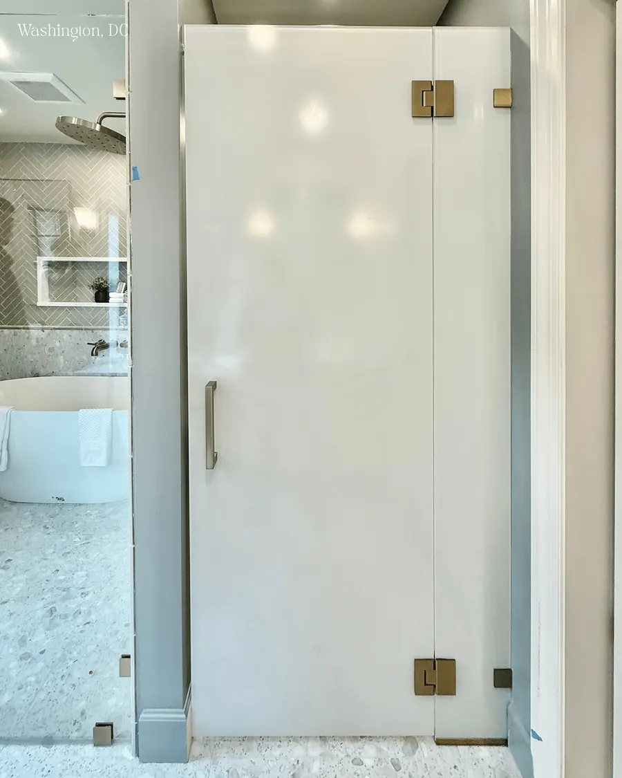 Door and panel frameless glass shower enclosure, brushed nickel hardware, satin etched