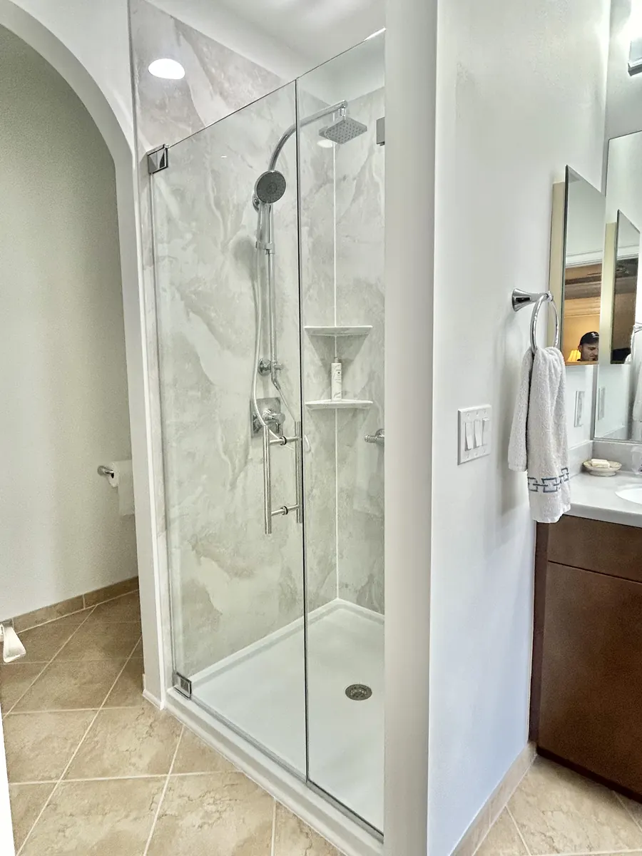 Door and panel frameless glass shower enclosure, polished chrome hardware, Frameless Shower Door in McLean