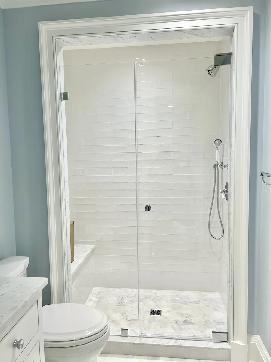 Door and panel frameless glass shower enclosure, polished chrome hardware, Shower Door with Knob in McLean Virginia