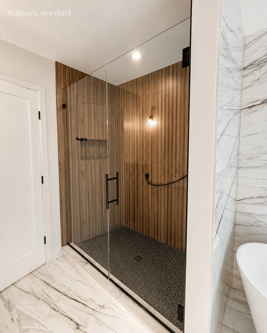Door and panel frameless glass shower enclosure, matte black hardware