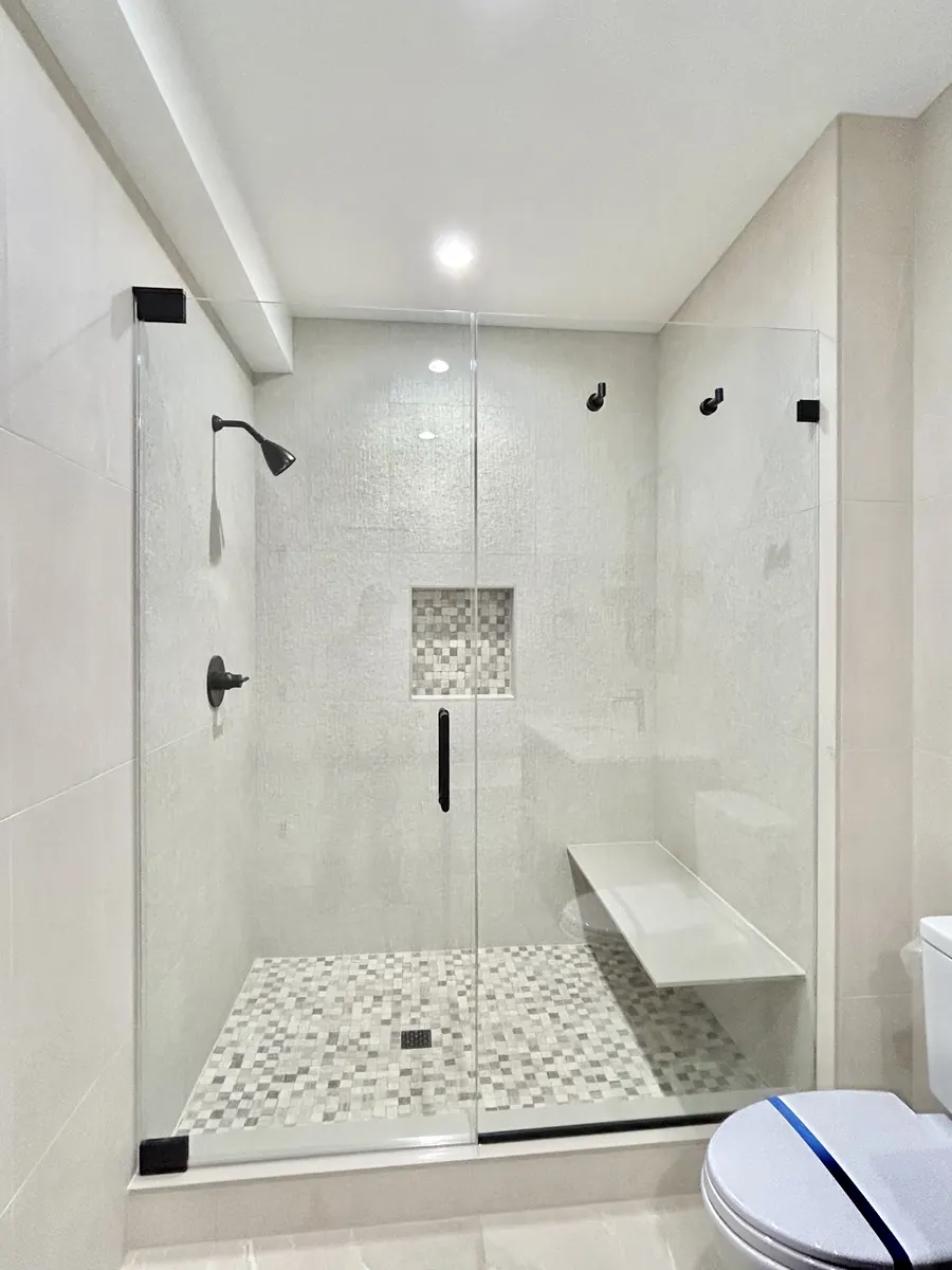 Door and panel frameless glass shower enclosure, matte black hardware, Shower Door in Baltimore