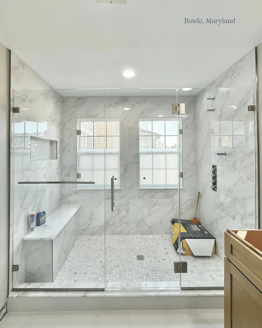 In-line panel frameless glass shower enclosure, brushed nickel hardware