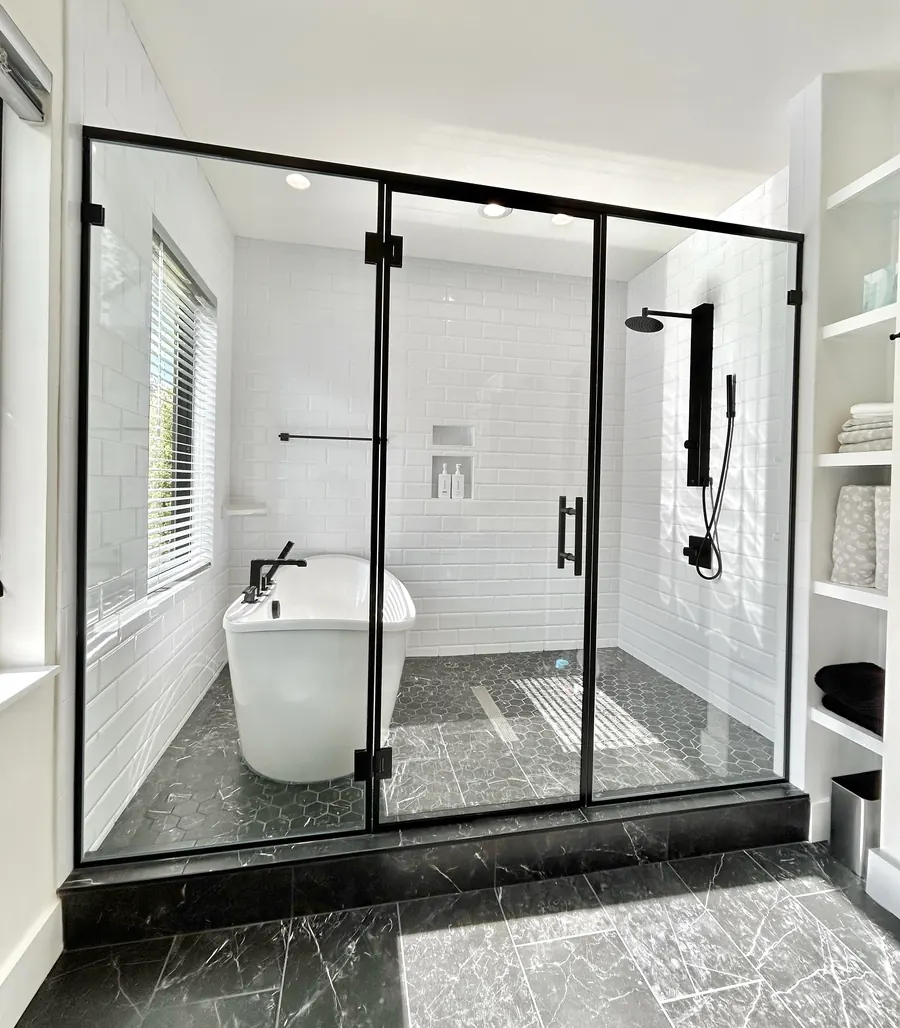 In-line panel frameless glass shower enclosure, matte black hardware, Custom Metal Frame Wrapped Shower Door