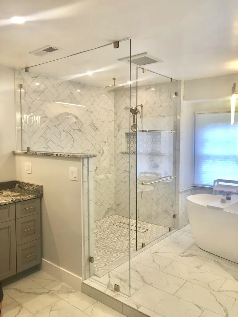 Walk-in frameless glass shower enclosure, nickel hardware, Spray Panels