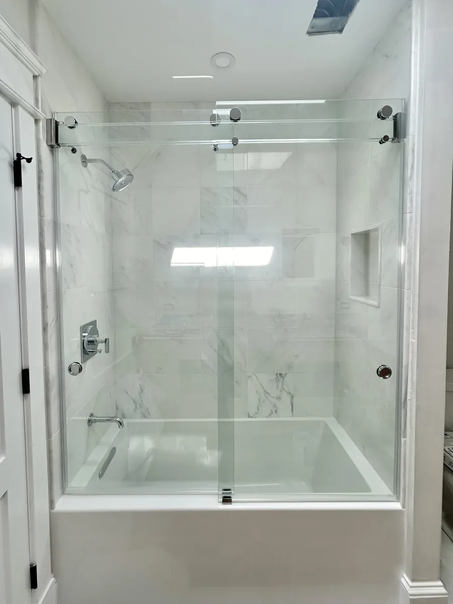 Phantom series frameless sliding shower door, polished chrome hardware, Glass Header Frameless Sliding Shower Doors