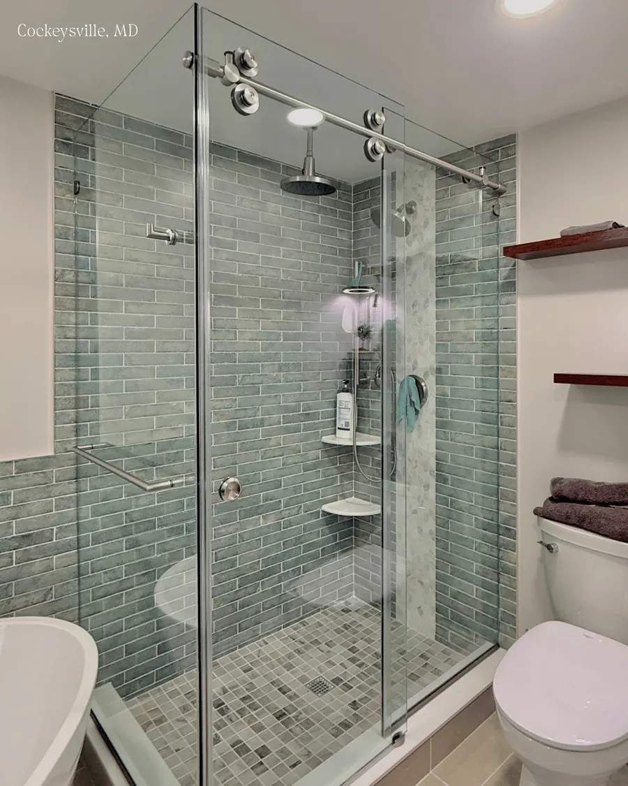 Titan series frameless sliding shower door, with a 90 degree return panel, polished chrome hardware
