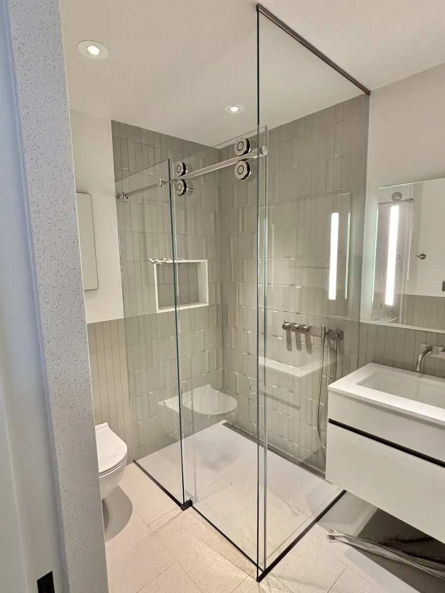Titan series frameless sliding shower door, with a 90 degree return panel, polished chrome hardware, Frameless Sliding Doors with 90 Degree Panel