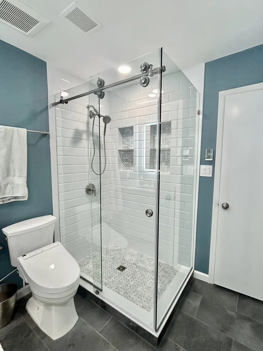Titan series frameless sliding shower door, with a 90 degree return panel, polished chrome hardware, Frameless Sliding Shower Door in Woodburn, Falls Church