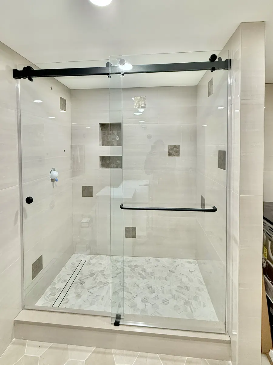 Titan Duo series frameless sliding shower door, matte black hardware