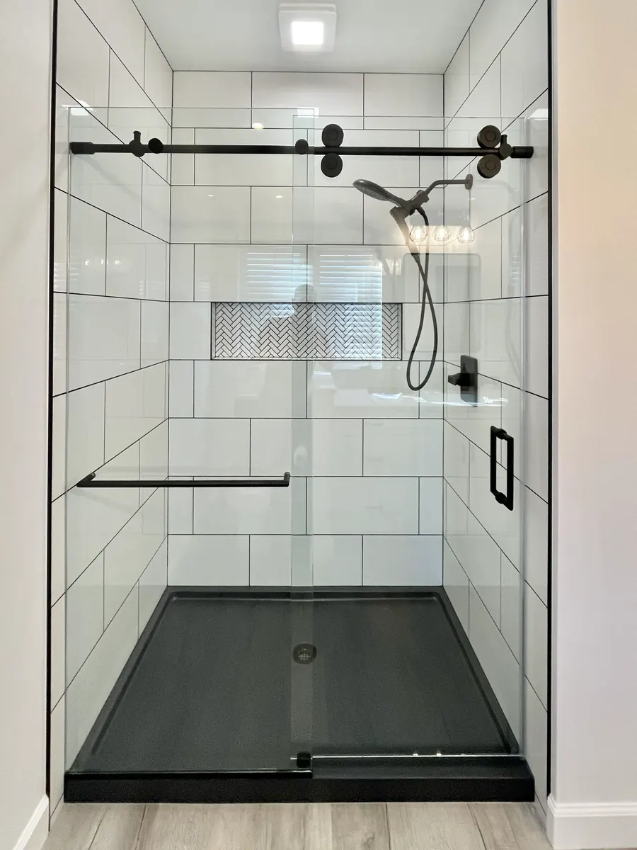 Titan series frameless sliding shower door, matte black hardware
