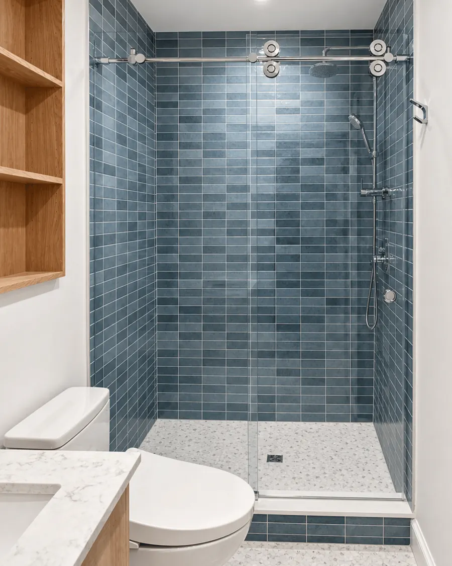 Titan series frameless sliding shower door, polished chrome hardware, blue tiles