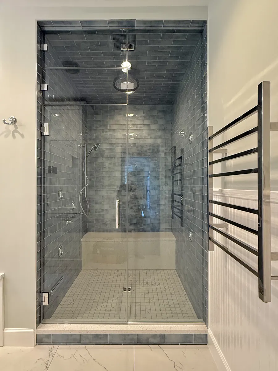 Steam shower enclosure, with operable and fixed transom above door for vent