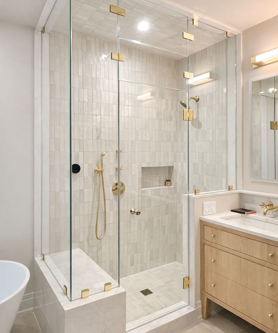 Corner steam shower enclosure with brass hardware